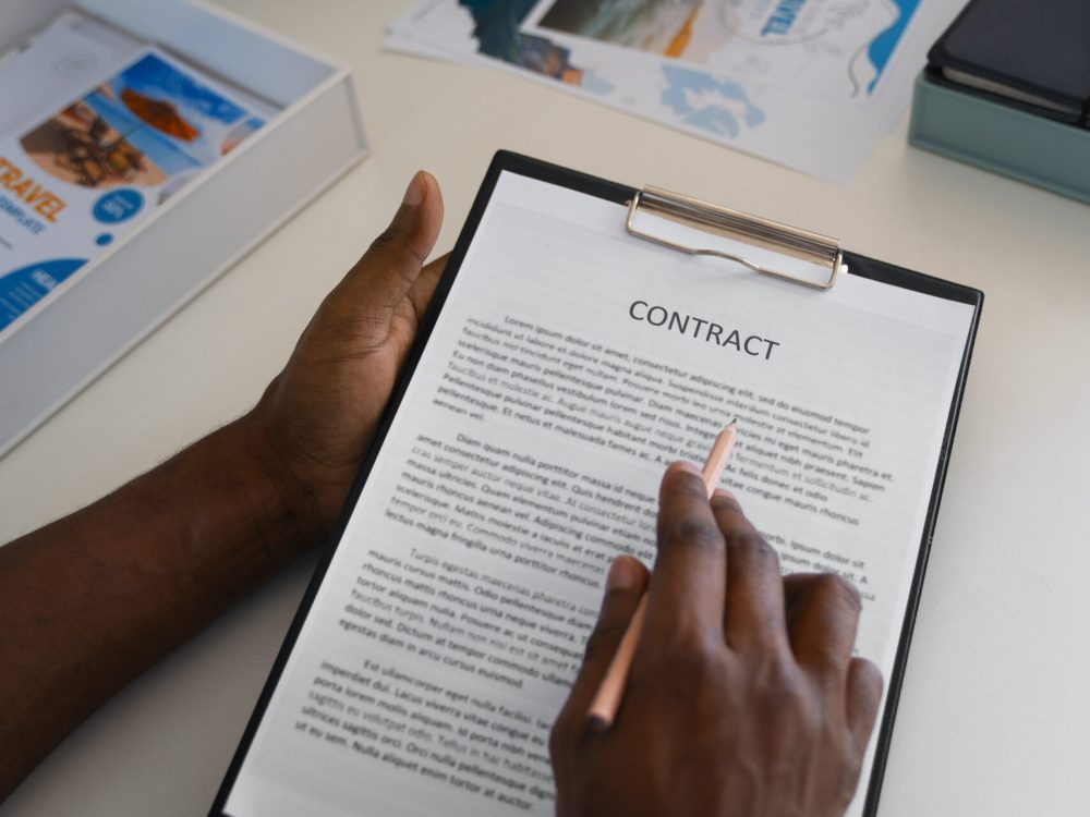 high-angle-man-reading-contract high-angle-man-reading-contract
